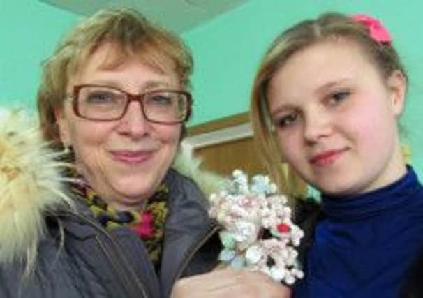 Ira Polyashova with Katya Kabashova, one of the chldren she has helped. Picture: contributed