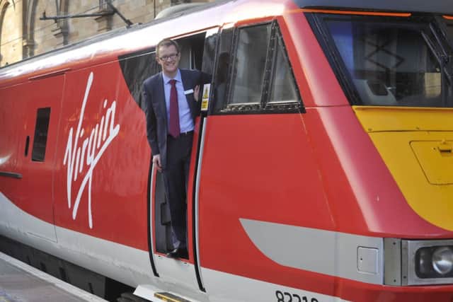 Virgin Trains managing director David Horne climbs aboard at Waverley. Picture: Phil Wilkinson