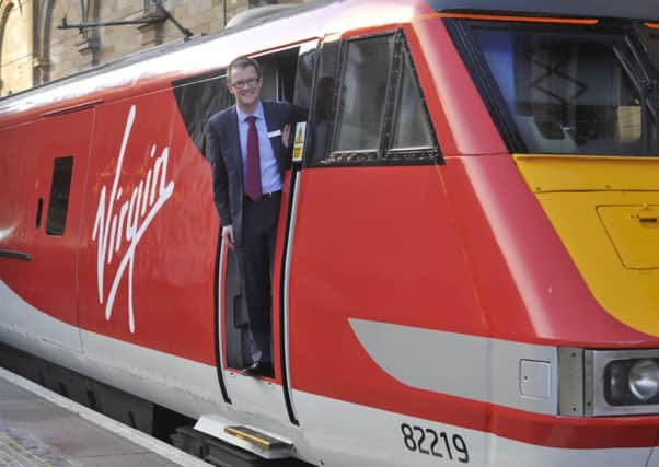 Virgin Trains managing director David Horne climbs aboard at Waverley. Picture: Phil Wilkinson