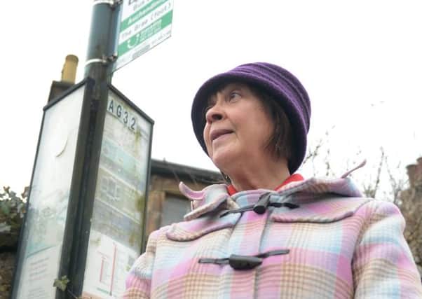 Rachel Milne at the bus stop for the axed service in Auchendinny. Picture: Neil Hanna