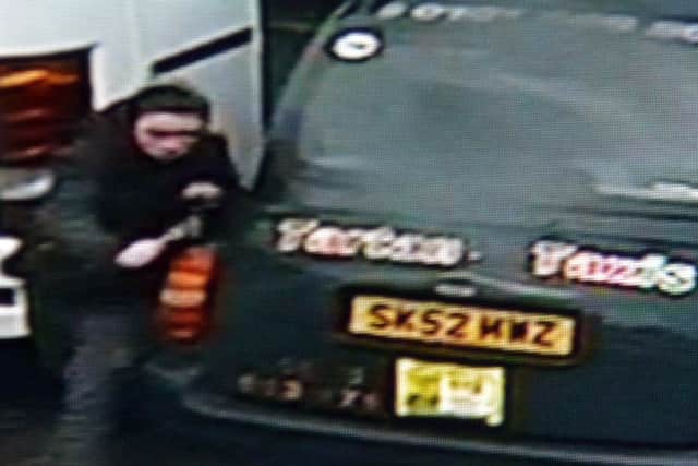 A youth caught on CCTV destroying vehicles. Picture: JON SAVAGE