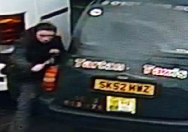A youth caught on CCTV destroying vehicles. Picture: JON SAVAGE