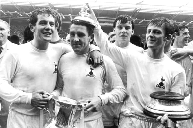 Spurs captain Dave Mackay is crowned by teammate Jimmy Robertson after victory in the 1967 FA Cup Final. Picture: Getty