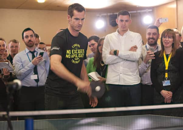 Feeling the pressure: Andy Murray demonstrates his skills with a bat. Picture: contributed