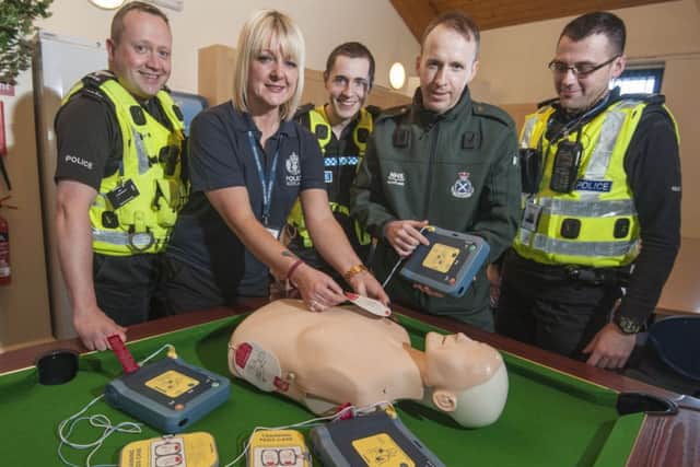 Karen Greechan, Jamie Skinner's cousin, with colleagues at Craigmillar police station. Picture: Phil Wilkinson