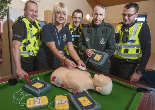 Karen Greechan, Jamie Skinner's cousin, with colleagues at Craigmillar police station. Picture: Phil Wilkinson