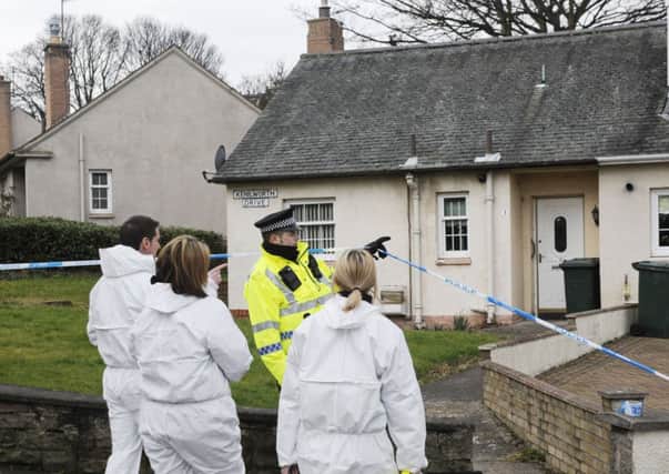 Police and forensics officers at the scene in Liberton. Picture: Greg Macvean