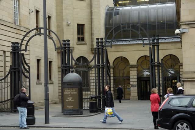 Both men pleaded guilty to assault and robbery charges at Edinburgh Sheriff Court. Picture: Greg Macvean