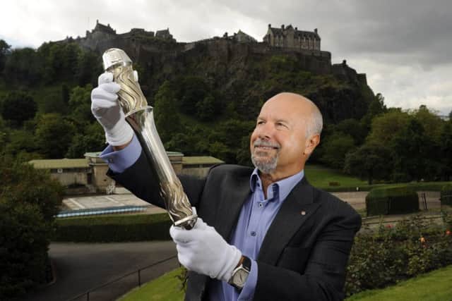 Michael Laing with the Queen's Baton in 2014. Picture: comp