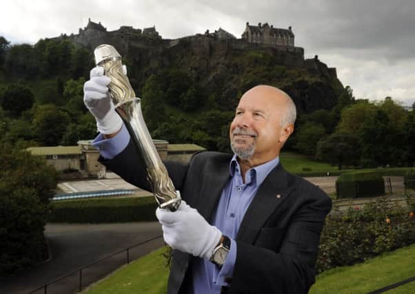 Michael Laing with the Queen's Baton in 2014. Picture: comp