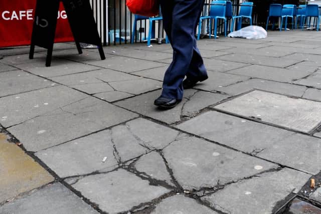 The two-man team will scour the city for broken pavements. Picture: Lisa Ferguson