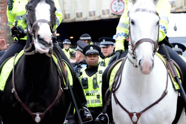 Police patrolling a previous SDL march in Edinburgh