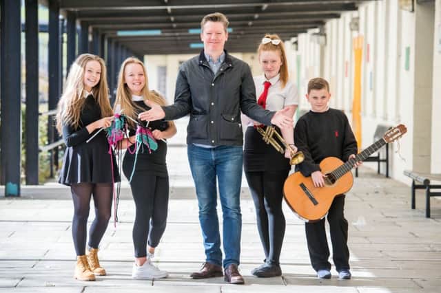 Edinburgh Festival director Fergus Linehan with pupils at Castlebrae School. Picture: Ian Georgeson