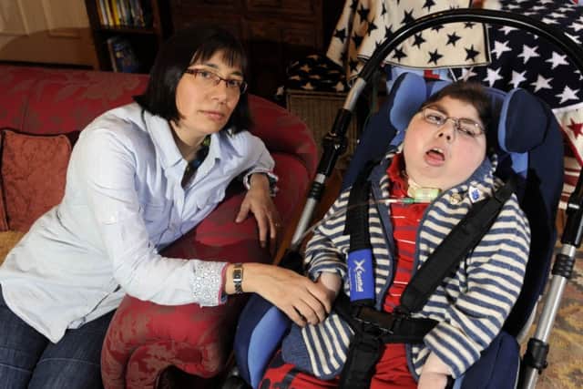 Adam Bojelian with mum Zoe. Picture: Greg Macvean