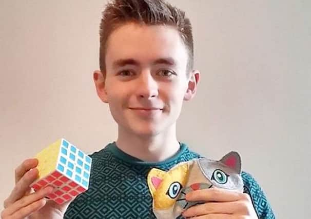 Oliver Frost solved the Rubik's Cube in record timing. Picture: Hemedia