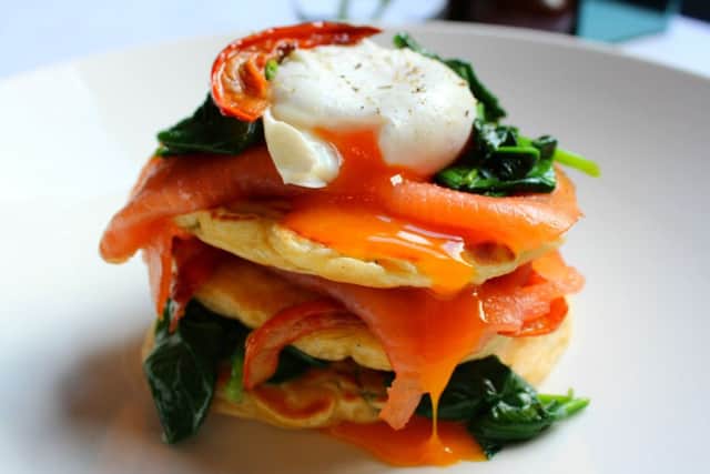 Sweetcorn and Basil Fritters, Smoked Salmon, Wilted Spinach, Semi-Dried Tomato, Poached Egg. Picture: Comp
