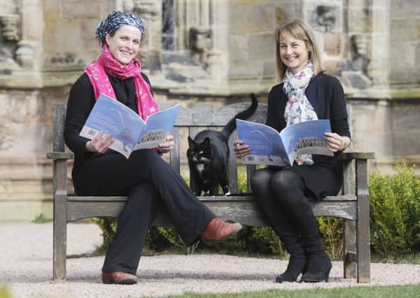 William the cat takes it easy at Rosslyn Chapel with the book's author, Helen Countess of Rosslyn, right, and illustrator Rosie Wellesley. Picture: Greg Macvean