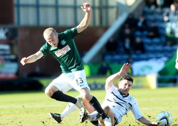 Raith Rovers' Liam Fox tackles Dylan McGeouch. Picture: SNS