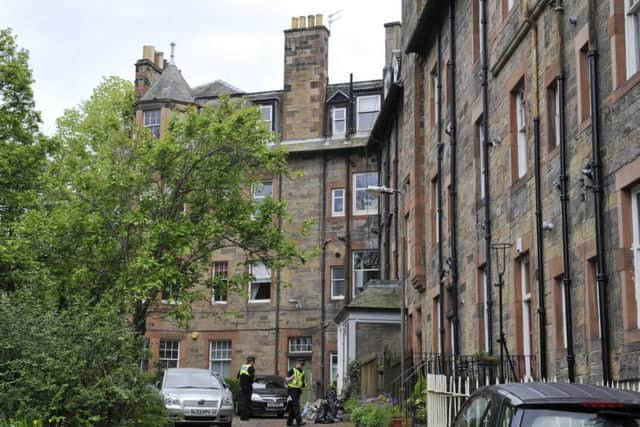 Police attend the flat in Roseburn Terrace. Picture: Phil Wilkinson