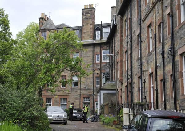 Police attend the flat in Roseburn Terrace. Picture: Phil Wilkinson