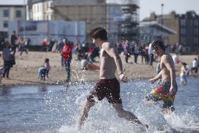 Cooling off on Easter Sunday at Portobello beach. Picture: Toby Williams