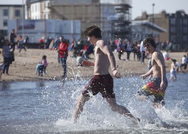 Cooling off on Easter Sunday at Portobello beach. Picture: Toby Williams