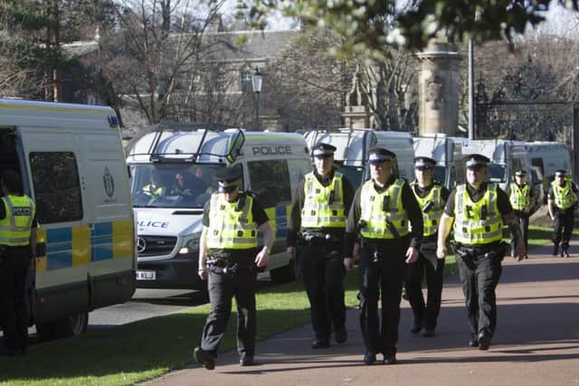 Police prepare to leave following the Pegida protest and counter-demonstration. Picture: Toby Williams