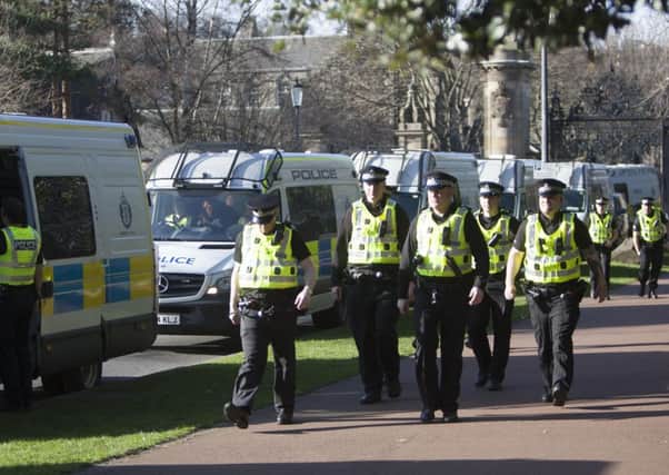 Police prepare to leave following the Pegida protest and counter-demonstration. Picture: Toby Williams