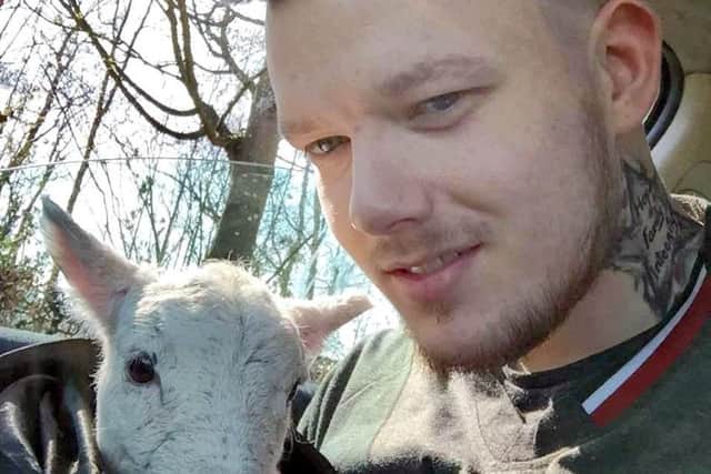 Alix Clarke with the lamb he rescued