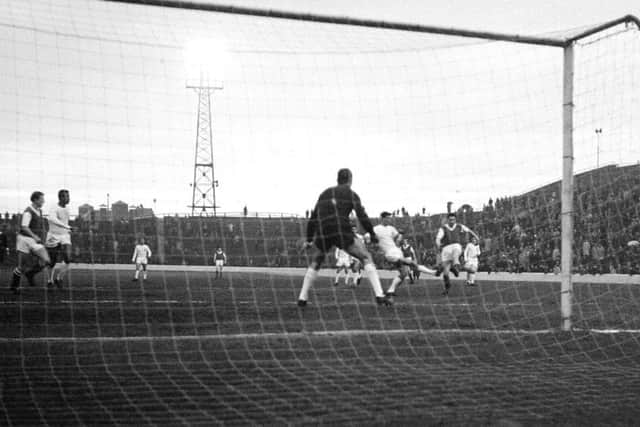 Tommy Preston scores for Hibs against Valencia at Easter Road in 1963. Picture: TSPL