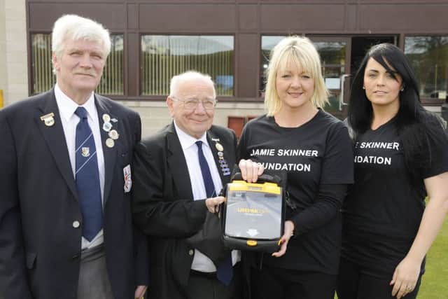 Sighthill Bowling Club vice-president Stan Blyth and president Ron McCandless with Jamie Skinner Foundation secretary Karen Greechan and chair Sonia McCraw, Jamie's sister, and the new defibrillator. Picture: Greg Macvean