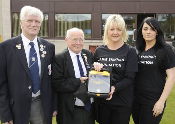 Sighthill Bowling Club vice-president Stan Blyth and president Ron McCandless with Jamie Skinner Foundation secretary Karen Greechan and chair Sonia McCraw, Jamie's sister, and the new defibrillator. Picture: Greg Macvean