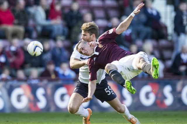 Raith Rovers' Craig Barr (left) brings down Soufian El Hassanoui. Picture: SNS