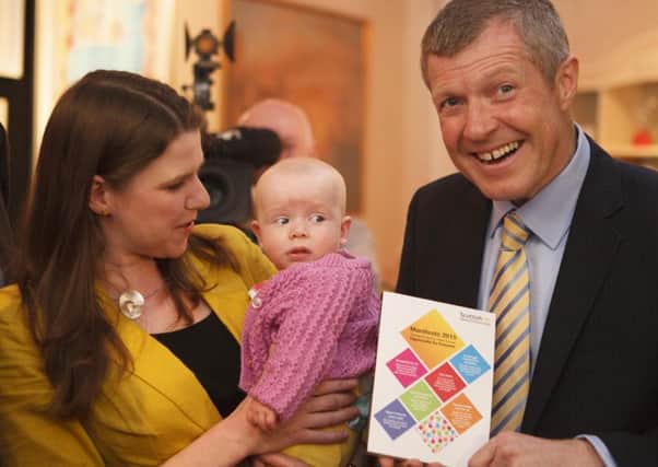 Willie Rennie and Jo Swinson are joined by four-month-old Martha Milne a the launche of the Lib Dem manifesto. Picture: Toby Williams