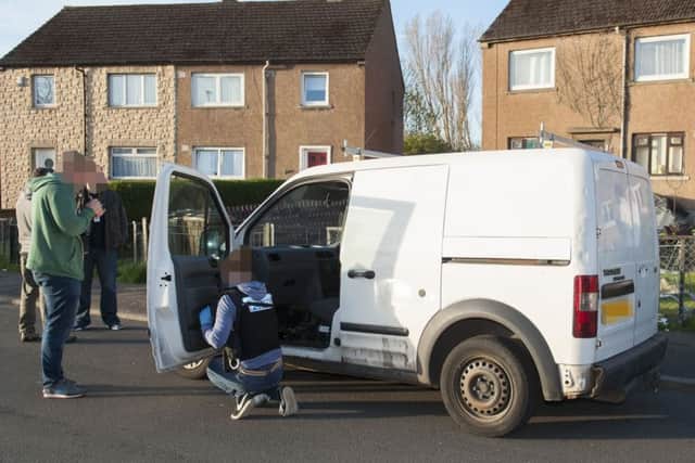 A van is searched during the police operation