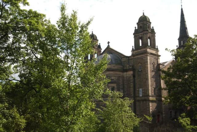 Police are investigating the body found near St Cuthbert's Church. Picture: Andrew Stuart