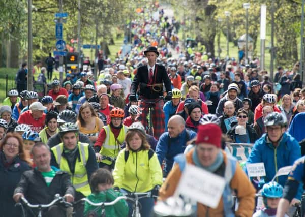 Pedal on Pariliament paricipants -including a man on stilts - make their way up Middle Meadow Walk. Picture: Andrew O'Brien