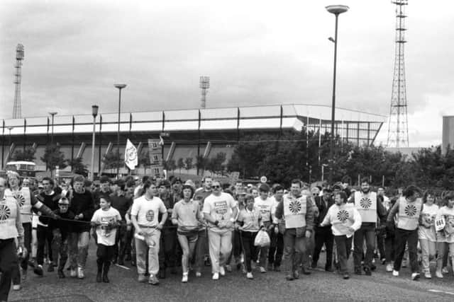 Some of the Round Table team at the rope as the Evening News Charity Walk gets under way at Meadowbank stadium in Edinburgh, September 1987