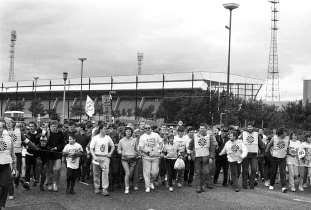 Some of the Round Table team at the rope as the Evening News Charity Walk gets under way at Meadowbank stadium in Edinburgh, September 1987