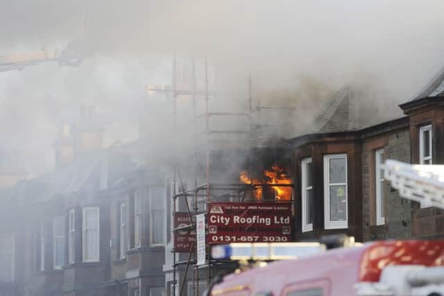 Firefighters tackle the blaze on Seaview Terrace. Picture: Greg Macvean
