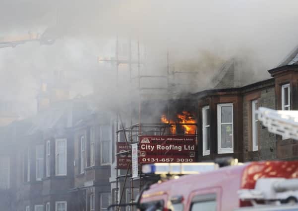 Firefighters tackle the blaze on Seaview Terrace. Picture: Greg Macvean
