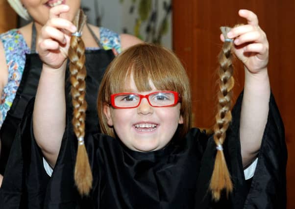 Christina Downie with her shorn locks. Picture: Lisa Ferguson