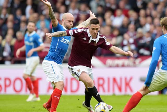 Rangers' Nicky Law, left, closes down Jamie Walker. Picture: SNS