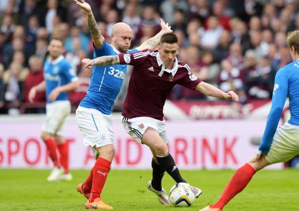 Rangers' Nicky Law, left, closes down Jamie Walker. Picture: SNS