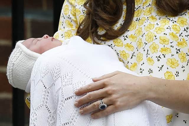 Kate, Duchess of Cambridge holds her newborn baby princess. Pic: AP Photo/Kirsty Wigglesworth