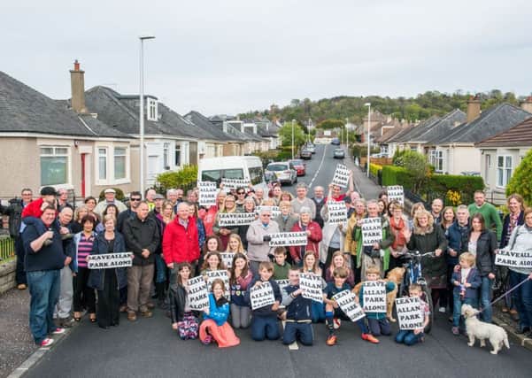 Residents of Allan Park Crescent protest about the proposed demolition of a house to create an access road. Picture: Ian Georgeson