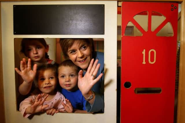 Nicola Sturgeon is inside Number 10 . . with kids at the ABC Nursery in Dedridge. Picture: PA