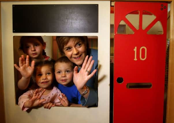 Nicola Sturgeon is inside Number 10 . . with kids at the ABC Nursery in Dedridge. Picture: PA