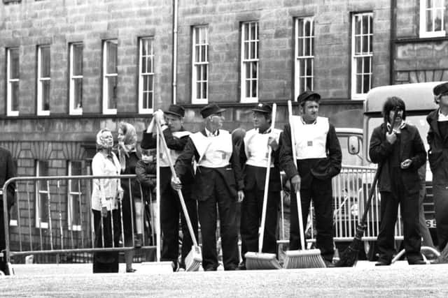 Men with brushes wait for the Queen's carriage to arrive in Charlotte Square in 1975; below, workmen resurface the road in 1960