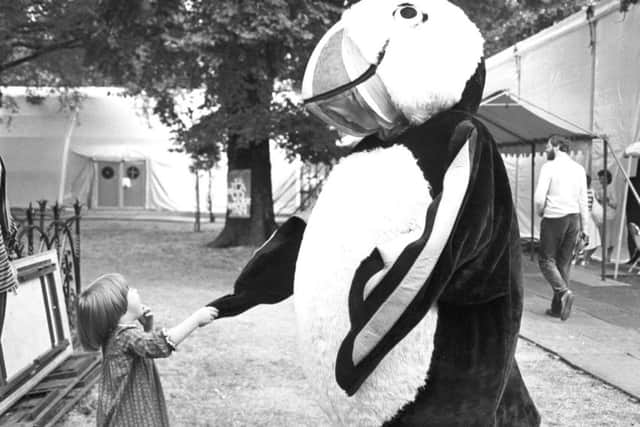 Three-year-old Catherine Blackwood meets a giant puffin at the Edinburgh Book Festival in Charlotte Square, August 1983.